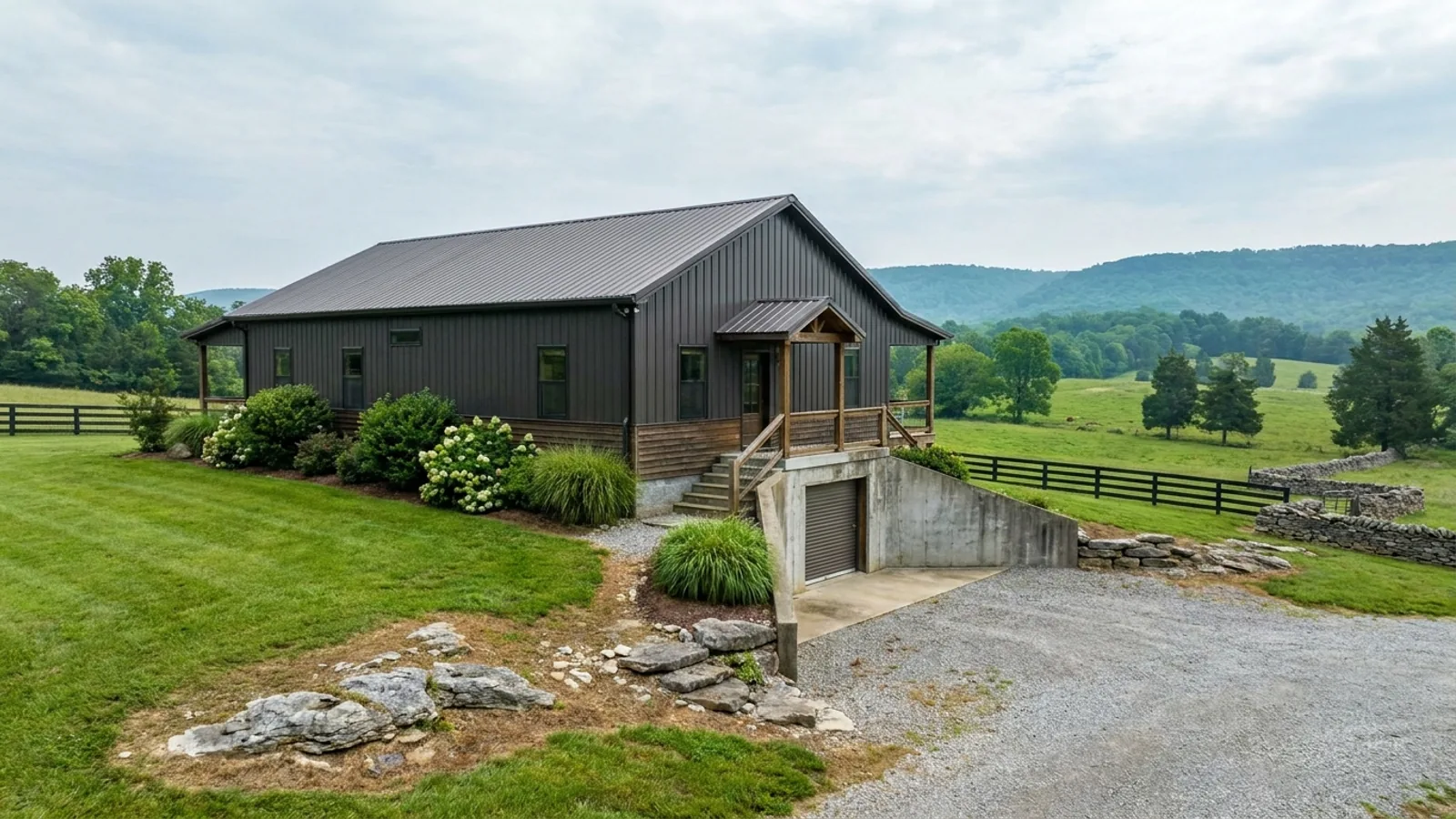 A barndominium raised on a stem-wall foundation with steps up to the entry and enclosed storage space beneath the elevated floor.