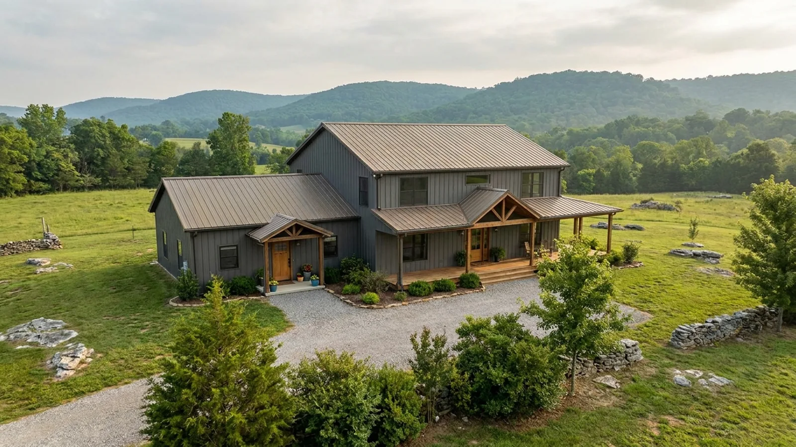 A barndominium with a smaller attached in-law suite wing that has its own separate covered entry, distinct from the main entry.