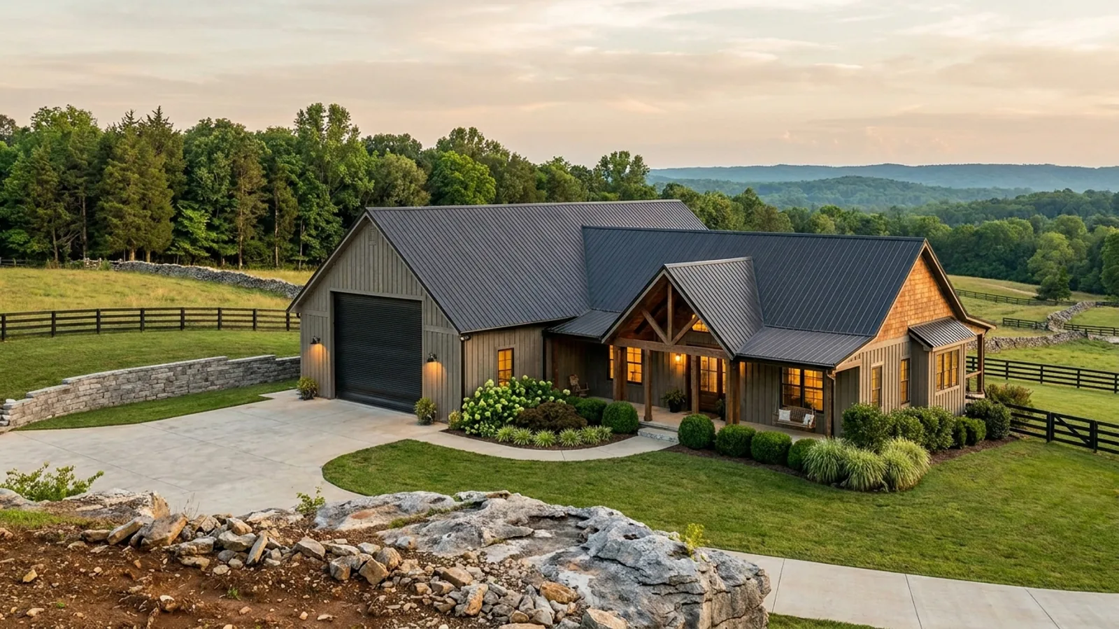 A barndominium with a tall, deep RV garage bay attached to the residence under one continuous roof.