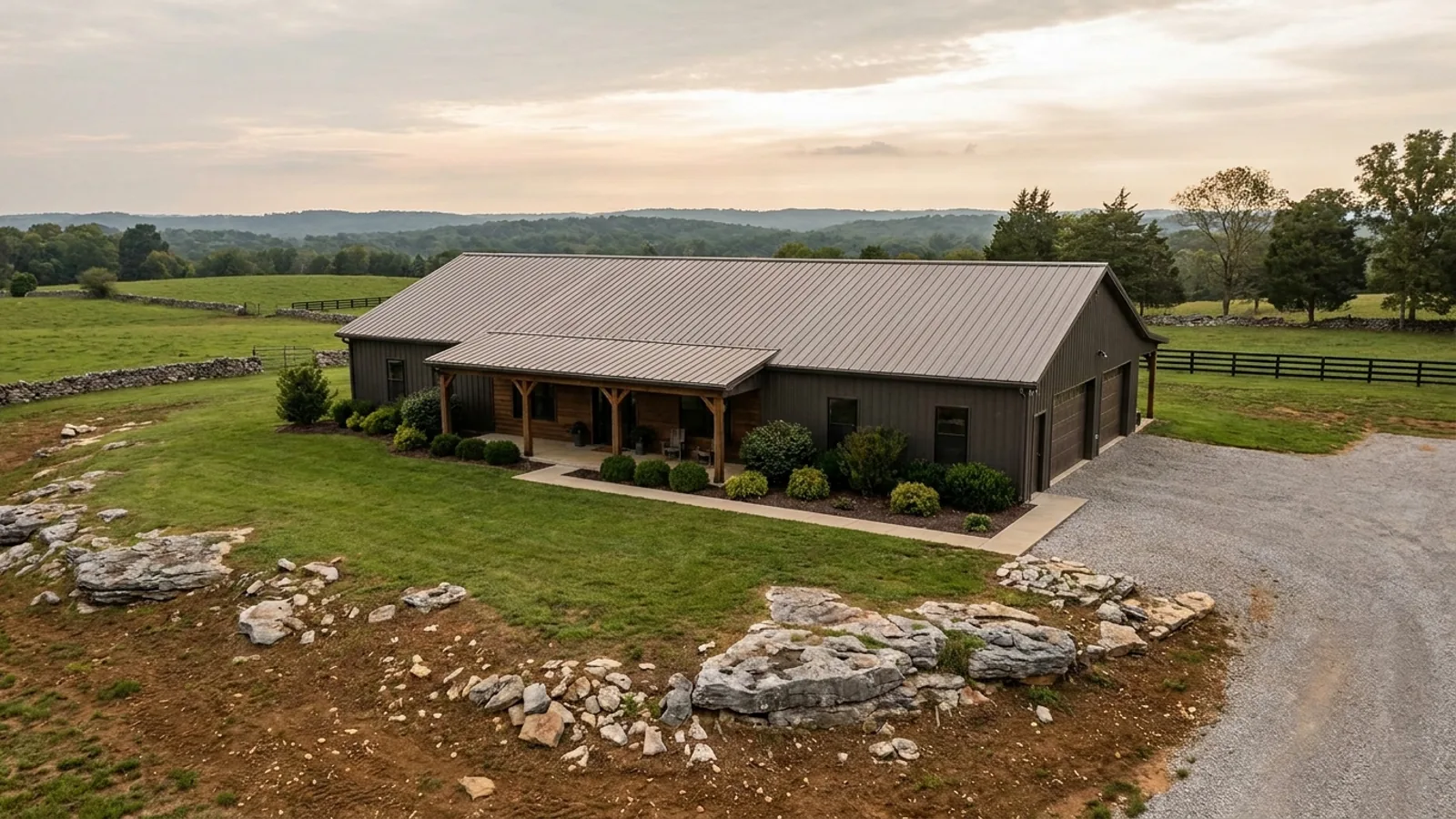 A completed single-story barndominium with a long, low roofline and no upper-level windows.